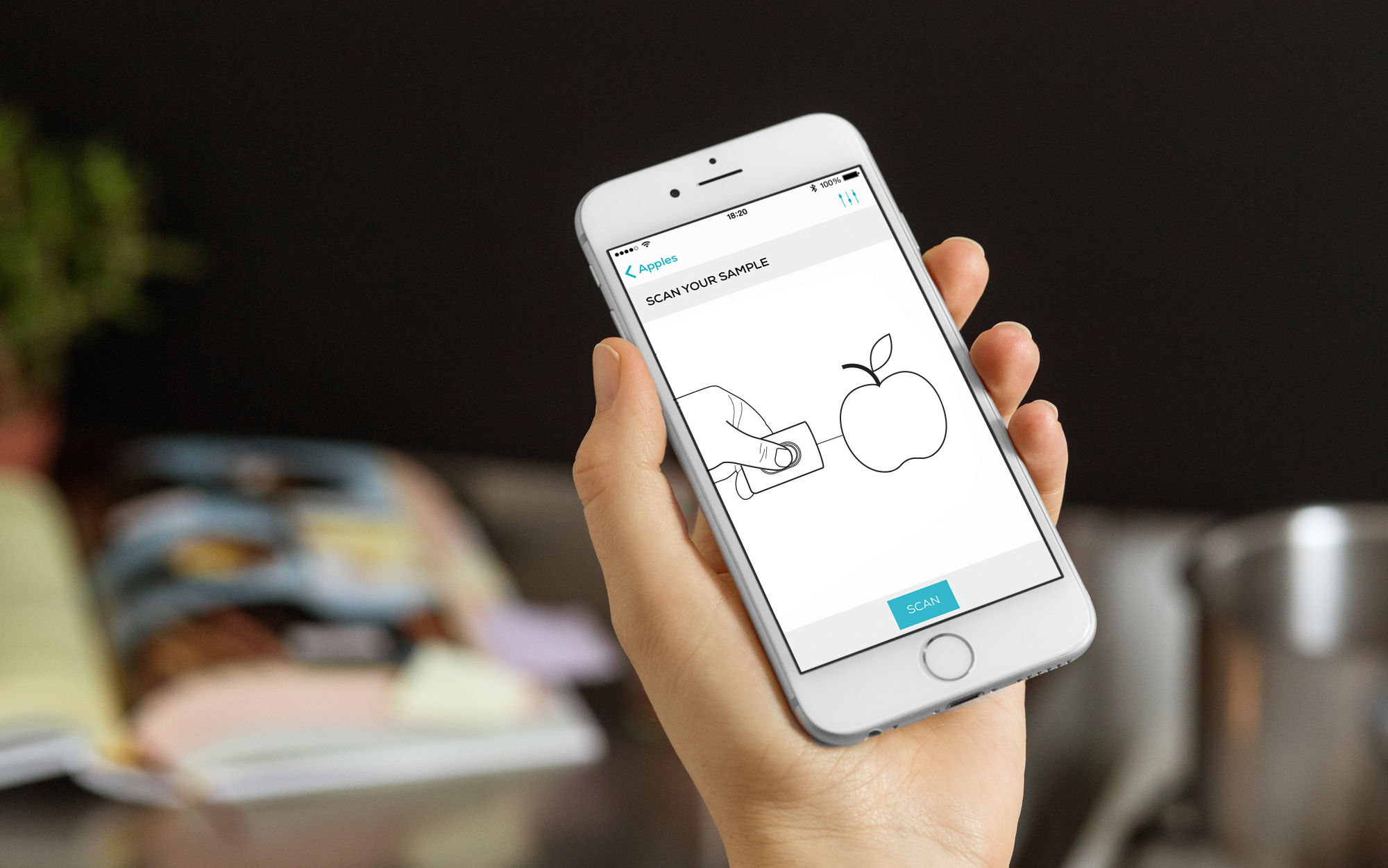Consumer Physics — hand holding iPhone with barcode scanning app